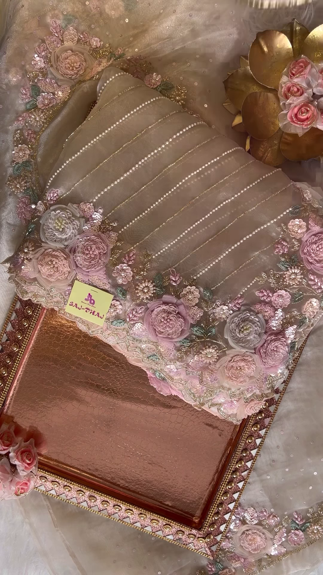 Elegant Embroidered Saree with Floral Motifs and Pearl Accents