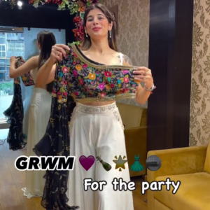 Midnight Glam: Black Pre-Draped Saree with Floral One-Shoulder Blouse