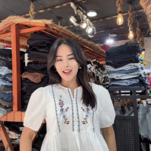 White Floral Embroidered Blouse with Light Blue Jeans – Casual Boutique Look for Women